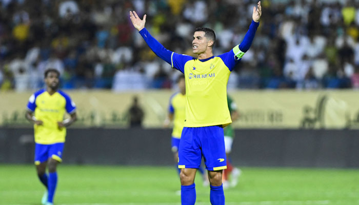 Portuguese forward Cristiano Ronaldo gestures during the Saudi Pro League football match between Al-Nassr and Al-Ettifaq at the Prince Mohammed Bin Fahd Stadium in Dammam on May 27, 2023. — AFP