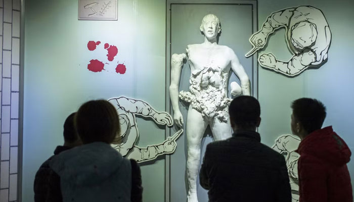 This picture shows visitors looking at a scene depicting human experiments at the Unit 731 museum in Harbin in northeast Chinas Heilongjiang province. — AFP/File