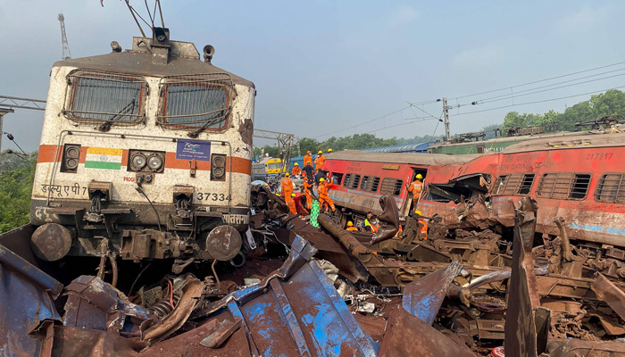 Damaged carriages at the accident site of a train collision near Balasore in Indias Odisha state, on June 3, 2023. — AFP