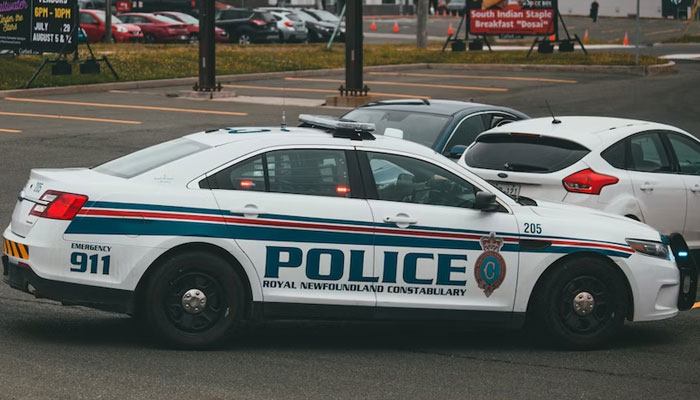 This representational picture shows a police car parked by a street. — Unsplash/File