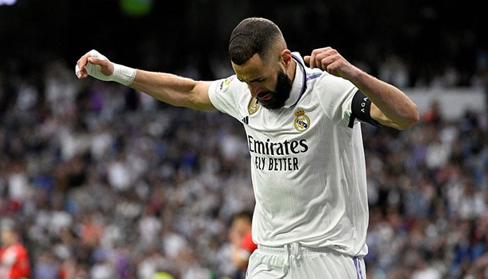 Real Madrid´s French forward Karim Benzema celebrates scoring his team´s first goal during the Spanish league football match between Real Madrid CF and Rayo Vallecano de Madrid at the Santiago Bernabeu stadium in Madrid on May 24, 2023. — AFP