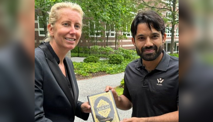 Pakistani cricketer Mohammad Rizwan (right) presents copy of Holy Quran to his teacher. — Twitter/@SharyOfficial