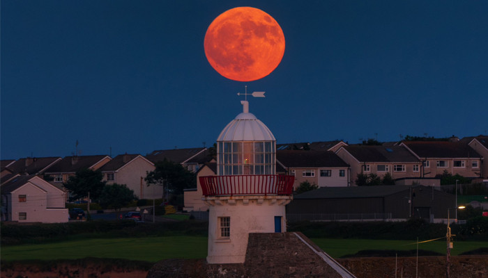 Strawberry moon illuminating sky around world gives breathtaking sights