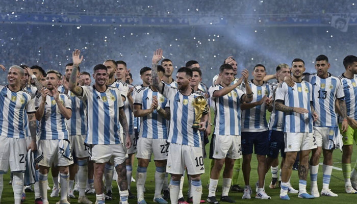 Lionel Messi (center) won the World Cup with Argentina in 2022 at the fifth time of asking. AFP/File