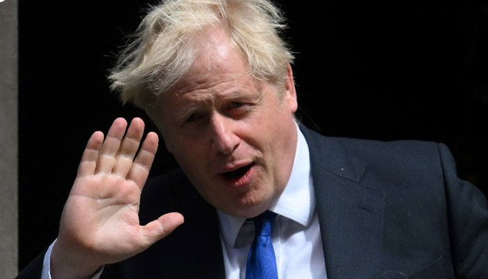 Former UK PM resigns as MP over Partygate report. AFP/File
