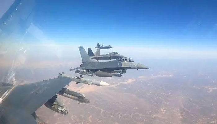 F-16 fighter jets accompany the F-22 Raptors heading to the Middle East. US Central Command.