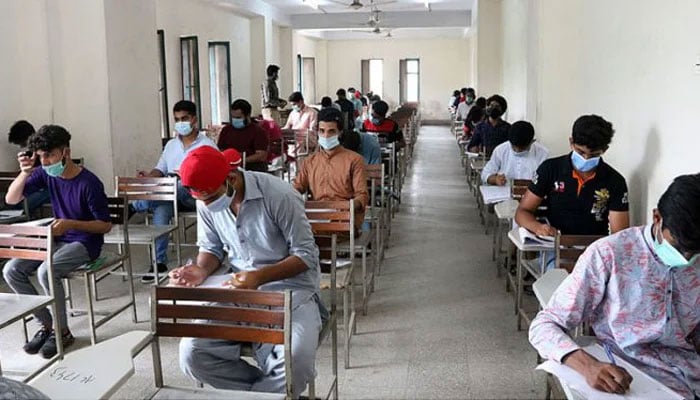 Students solve examination papers at a centre on Lahores Mall Road on July 29, 2021. — APP/File