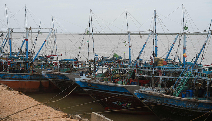 Fishing boats are seen moored along a jetty in Keti Bandar in Sindh on June 16, 2023, after Cyclone Biparjoy made landfall. — AFP/File
