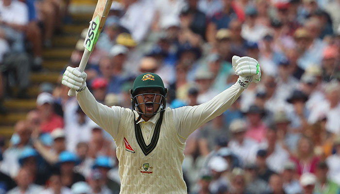 Australia´s Usman Khawaja celebrates after reaching his century during play on day two of the first Ashes cricket Test match between England and Australia at Edgbaston in Birmingham, central England on June 17, 2023.—AFP
