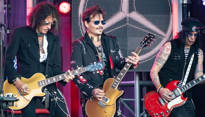 Johnny Depp rocks out with Hollywood Vampires onstage following ankle fracture