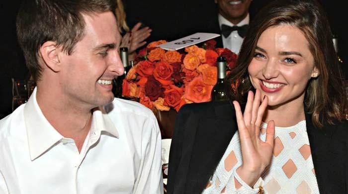 Miranda Kerr and Evan Spiegel pack on the PDA at the Louis Vuitton menswear  show in Paris