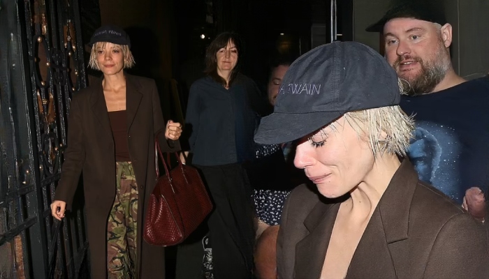 Lily Allen looks emotional as she greets fans outside Duke Of York Theatre