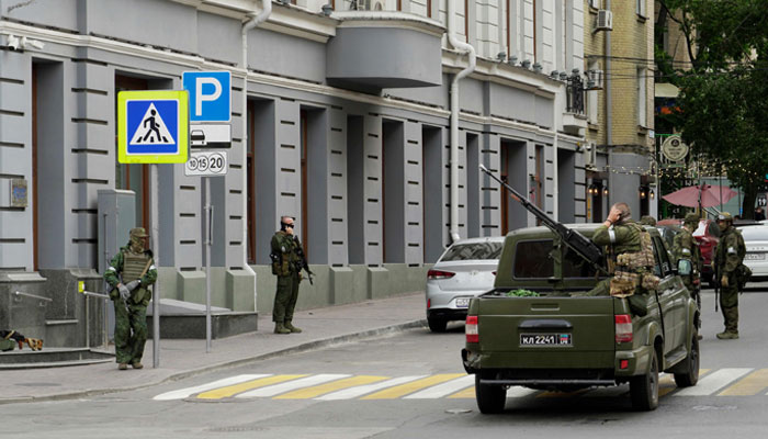Members of Wagner group stand guard in a street in the city of Rostov-on-Don, on June 24, 2023.— AFP