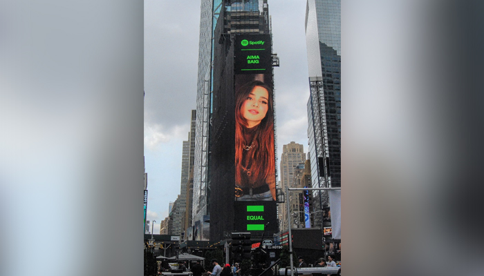 Pakistans Aima Baig shines at the Times Square, NYC, US. — Spotify