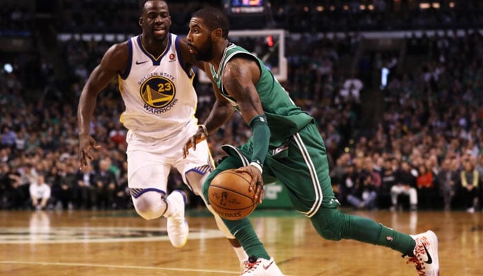 Draymond Green, left, and Kyrie Irving, right, agreed to long-term deals to stay with their most recent clubs as NBA free agency began for the 2023-24 season began. AFP/File