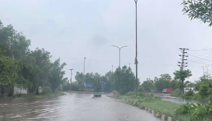 Heavy rainfall inundates a road in Lahore, on July 5, 2023, in this still taken from a video. — Twitter/@AhmadWaleed