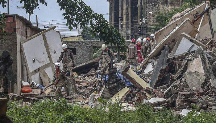 Brazilian emergency authorities say three people managed to survive a building collapse. EPA