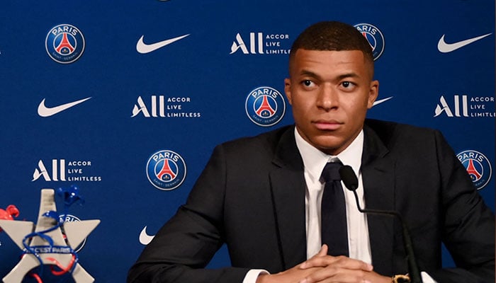 (FILES) Paris Saint-Germain´s CEO Nasser Al-Khelaifi (L) and French forward Kylian Mbappe (R) give a press conference at the Parc des Princes stadium in Paris on May 23, 2022.—AFP