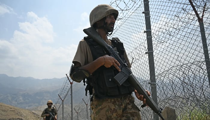 Pakistani troops patrol along the Afghanistan border at Big Ben post in Khyber district in Khyber Pakhtunkhwa province on August 3, 2021. — AFP