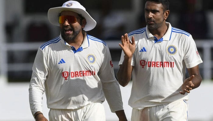 Ravichandran Ashwin (R) ran through the West Indies batting order and took 12 wickets in the first Test.  AFP