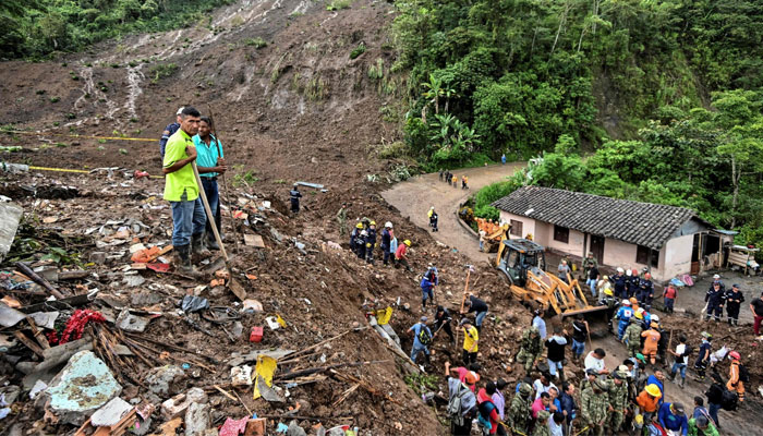 This representational picture shows people searching for victims after a landslide in Rosas, Valle del Cauca department, in southwestern Colombia, on Sunday, 22 April 2019. —  AFP