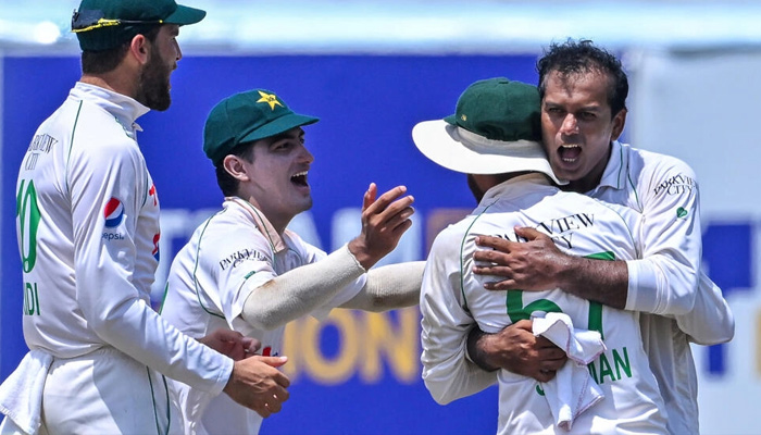 Pakistan cricketers congratulate spinner Noman Ali who took two wickets against Sri Lanka on day four of a rain-interrupted first Test in Galle on July 19, 2023. — AFP