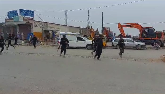 Policemen on alert Policemen at Bara Bazar in KPs Khyber district, on July 20, 2023, in this still taken from a video. — Reporter