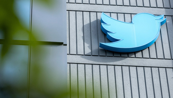The Twitter logo is seen on a sign on the exterior of Twitter headquarters in San Francisco, California, on October 28, 2022. — AFP