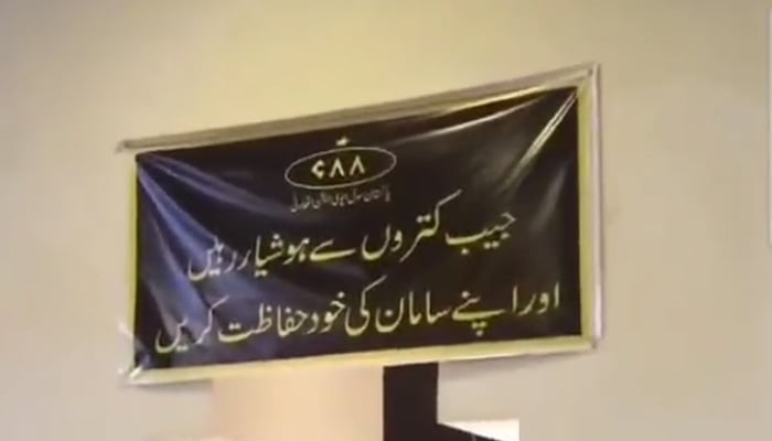 A screengrab showing CAAs caution banner put up at a spot at Jinnah International Airport. — Twitter/@ArifRohila
