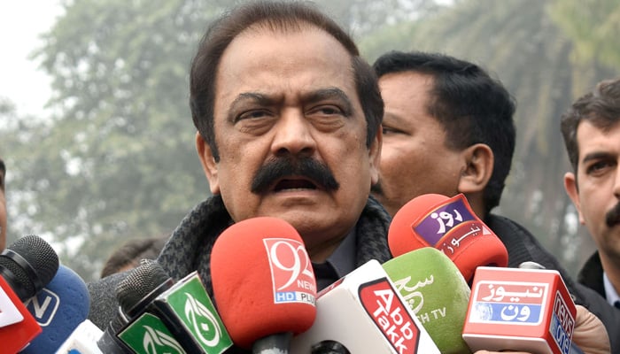 Interior Minister Rana Sanaullah Khan talks to journalists outside the Governor House in Lahore on December 22, 2023. — Online