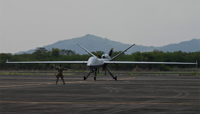 A US soldier guides the MQ-9 Reaper drone as it lands at Subic Bay Freeport Zone on April 23, 2023, as part of the US-Philippines joint military exercise. — AFP