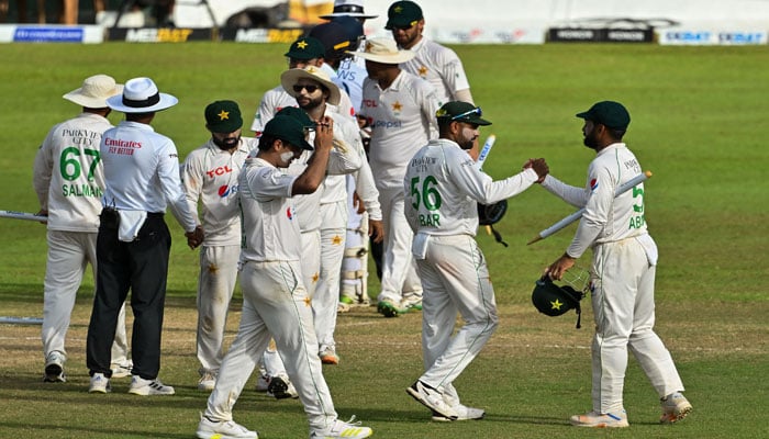 Pakistans cricketers celebrate after their teams victory by an innings and 222 runs during the fourth day of the second and final Test match between Pakistan and Sri Lanka at the Sinhalese Sports Club (SSC) Ground in Colombo on July 27, 2023. — AFP