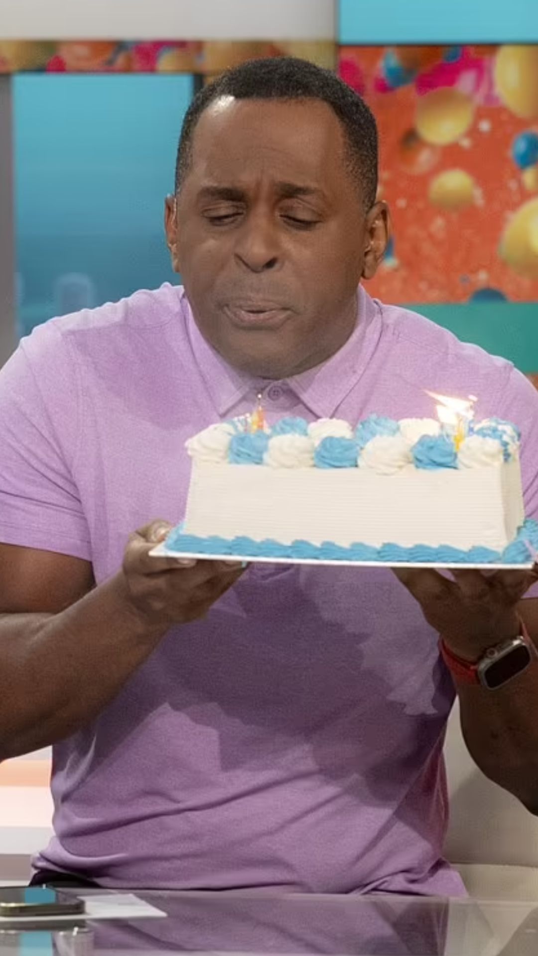 TV presenter Andi Peters cuts his birthday cake on ‘Good Morning Britain’