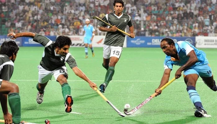 Indias Vikram Vishnu Pillay (right) vies for the ball with Pakistans Waseem Ahmed during their field hockey match for the XIX Commonwealth Games at the Major Dhyan Chand National Stadium in Delhi. Photo: AFP/File