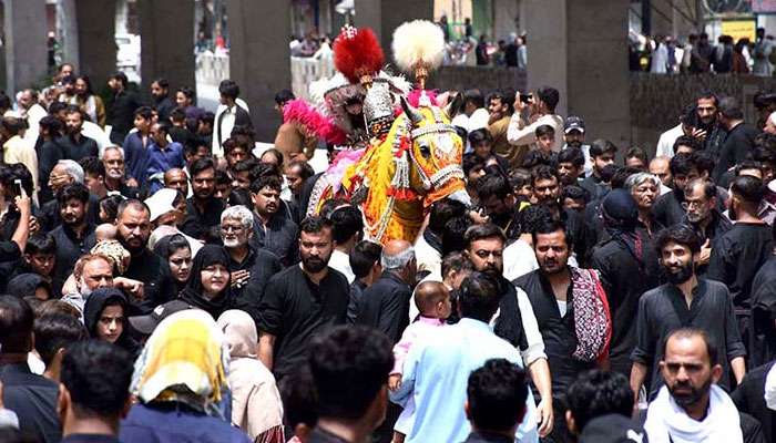 A large number of Shia Muslims participate in 10th Muharram procession to mark Ashoura in Rawalpindi on July 29, 2023. — APP