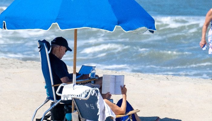 President Biden rides bike, goes shirtless on Delaware beach. AFP