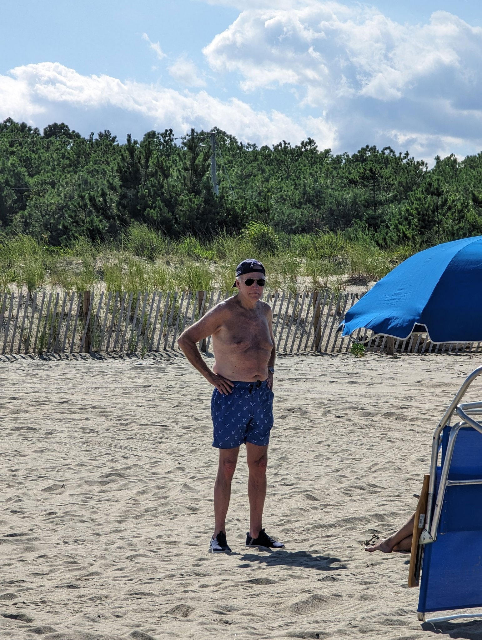 President Biden was photographed shirtless while enjoying his leisure time on the Delaware beach. Twitter