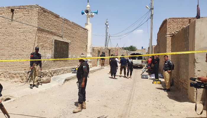 Police and rescue teams seen standing at the site where a polio team was attacked in Quetta, on August 1, 2023. — Reporter