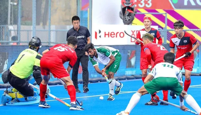 Pakistan-Korea players in action. — Hockey India
