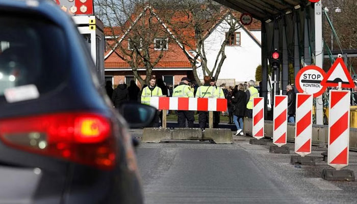 Danish police officers guard the now-closed Danish-German border crossing on March 14, 2020. — AFP/File