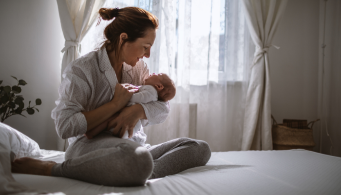 A representational image of a mother with her newborn baby. — Canva