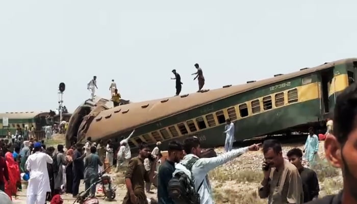 People busy in rescue efforts after a trail derailed at Sarhari Railway Station near Nawabshah, on August 6, 2023, in this still taken from a video. — Geo News