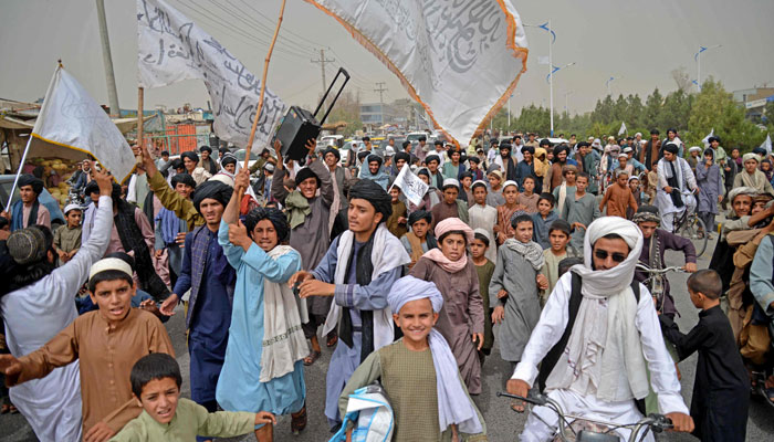 Taliban supporters march during a rally to celebrate the second anniversary of Taliban´s takeover in Kandahar on August 15, 2023. — AFP