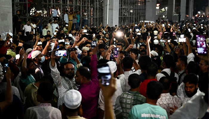 Supporters of Delwar Hossain Sayeedi chant slogans as they gather in front of a hospital, where he died following a heart attack, in Dhaka on August 14, 2023.—AFP