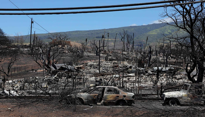A view of a neighbourhood destroyed by a wildfire is seen on August 17, 2023 in Lahaina, Hawaii. — AFP