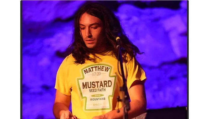 Ezra Miller takes the stage at Matisyahus concert.