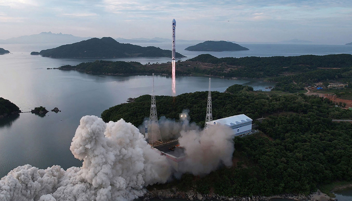 This picture released on June 1, 2023, shows a satellite-carrying rocket as it lifts off, at an undisclosed location in North Korea. — Korean Central News Agency