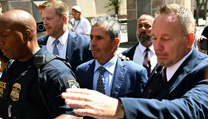 Carlos De Oliveira (C), personal aide to former US President Donald Trump, leaves the James L. King Federal Courthouse in Miami, Florida, on July 31, 2023. — AFP/FIle