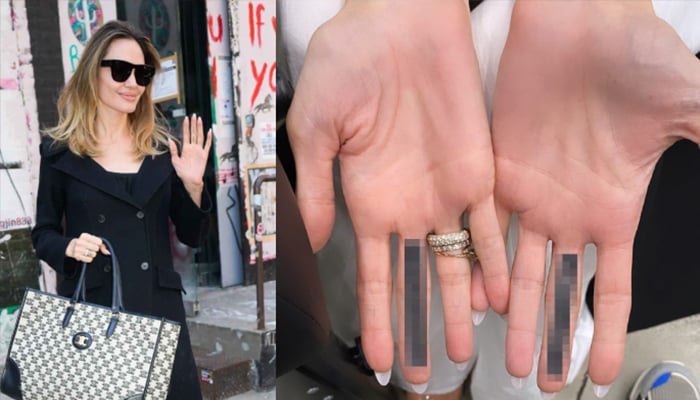 Fans think Angelina Jolie's new middle finger tattoo is message to Brad Pitt