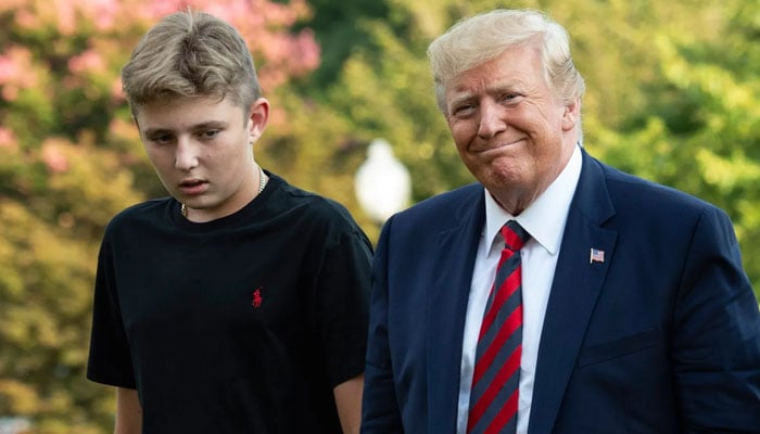 Donald Trump and his son Barron Trump. — AFP